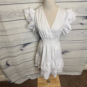 White dress, ruffle trim, deep V neck